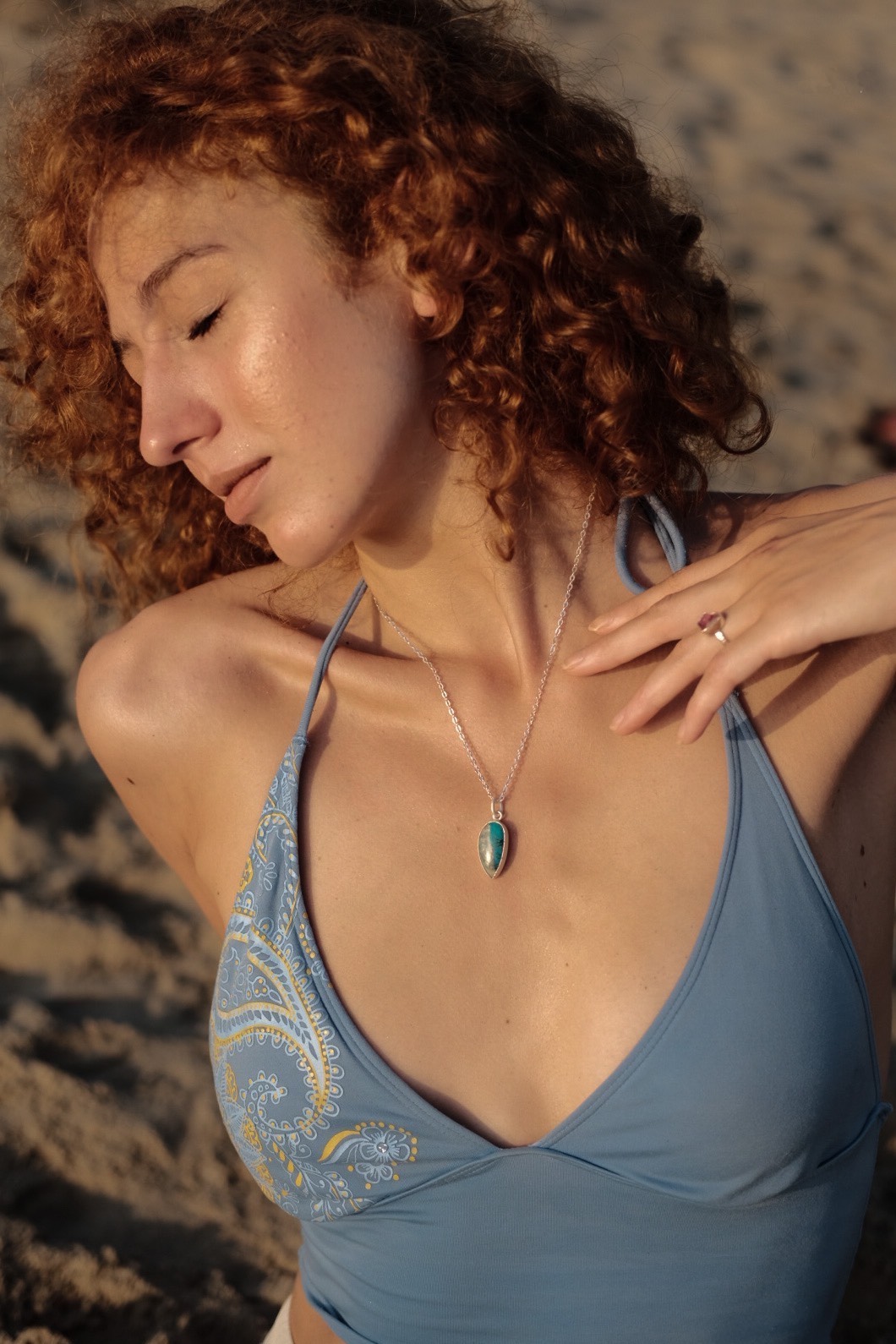 A model wears Soulcraft Jewelry made from gemstones and .999 silver