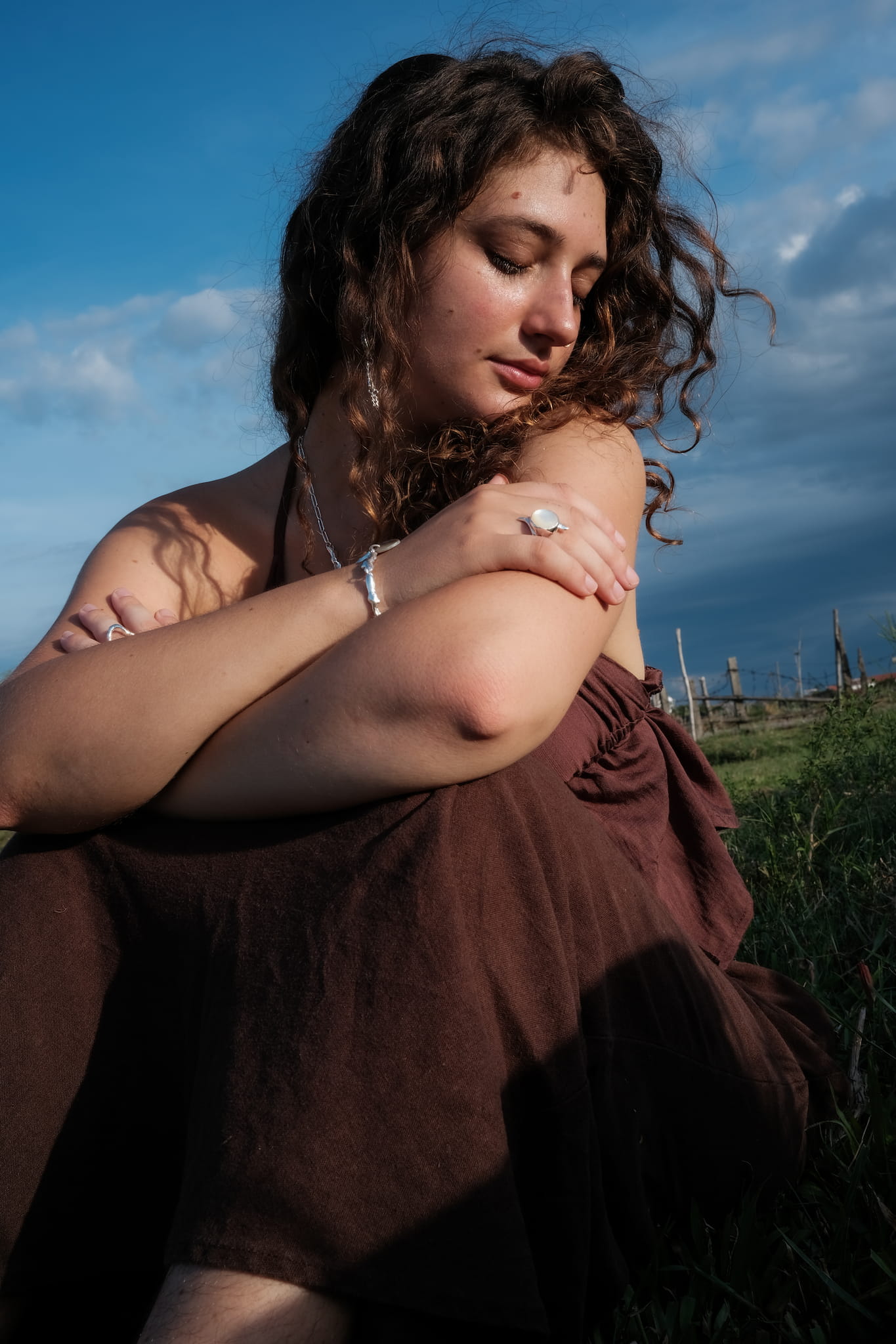 A model wears Soulcraft jewelry made from .999 silver.